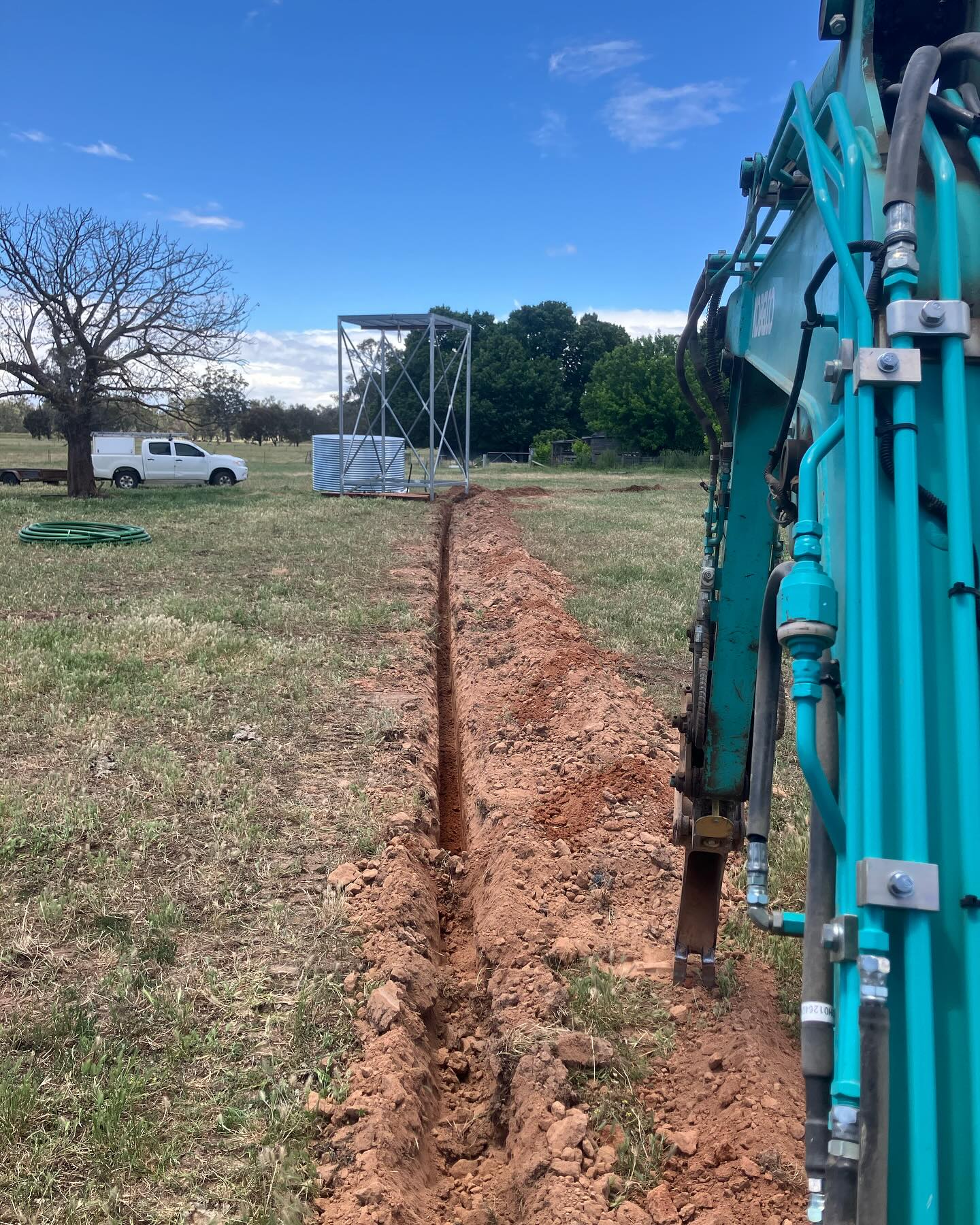 Narrow utility trench dug through a rural paddock outside Benalla