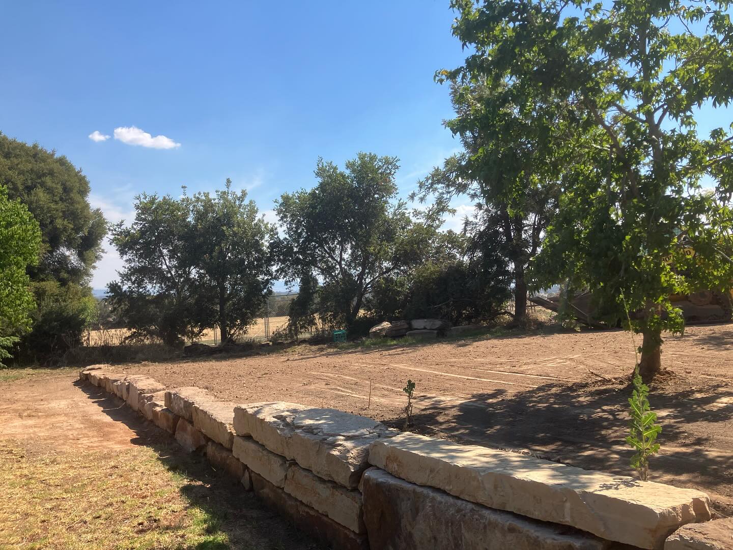 Completed dry-stone retaining wall on a rural Benalla property after Earth Haul Excavations landscaping work