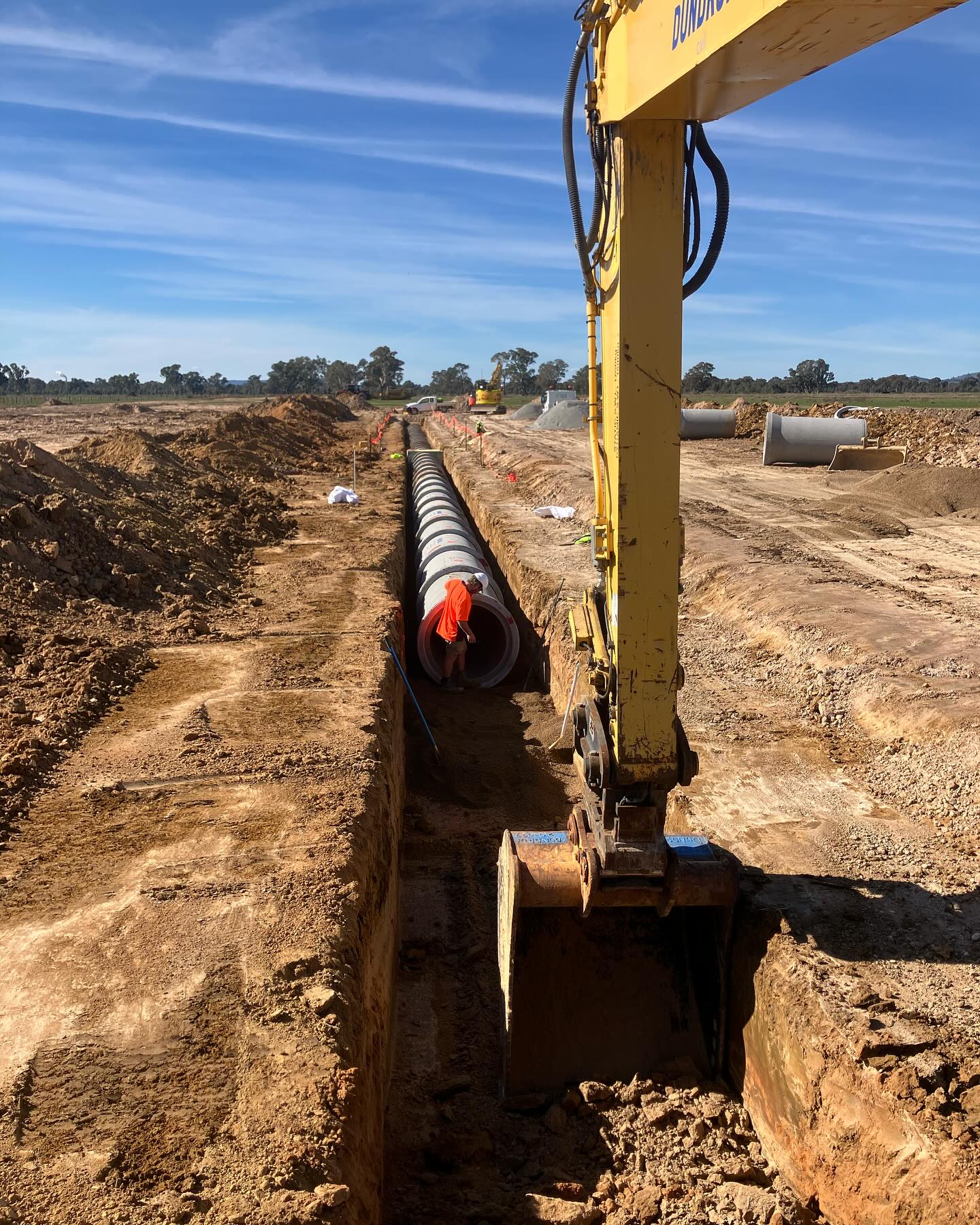 Long stormwater pipe trench dug for drainage work on a rural Benalla property